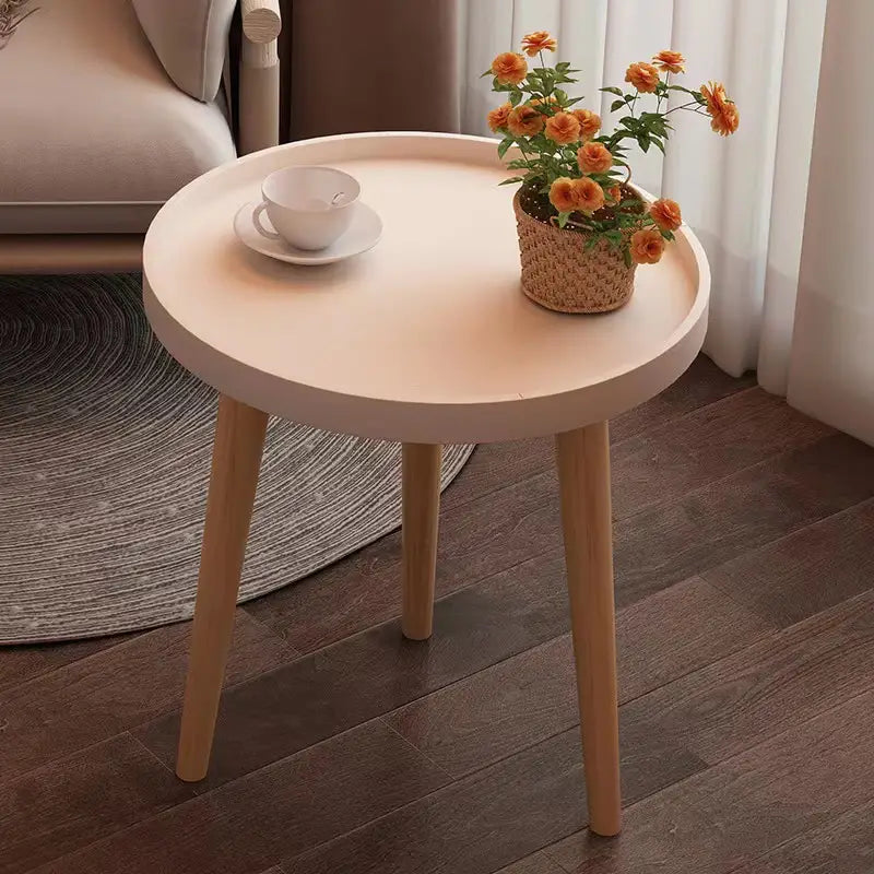 Embrace Elegance with the Round Coffee Table Boasting Three Harmonious Legs
