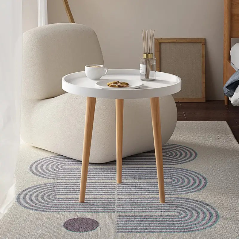 Embrace Elegance with the Round Coffee Table Boasting Three Harmonious Legs