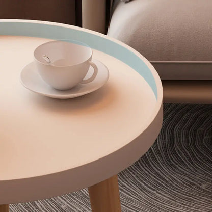 Embrace Elegance with the Round Coffee Table Boasting Three Harmonious Legs