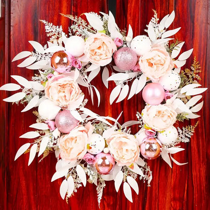 Blushing Elegance: A Pink Christmas Wreath Adorned with Baubles